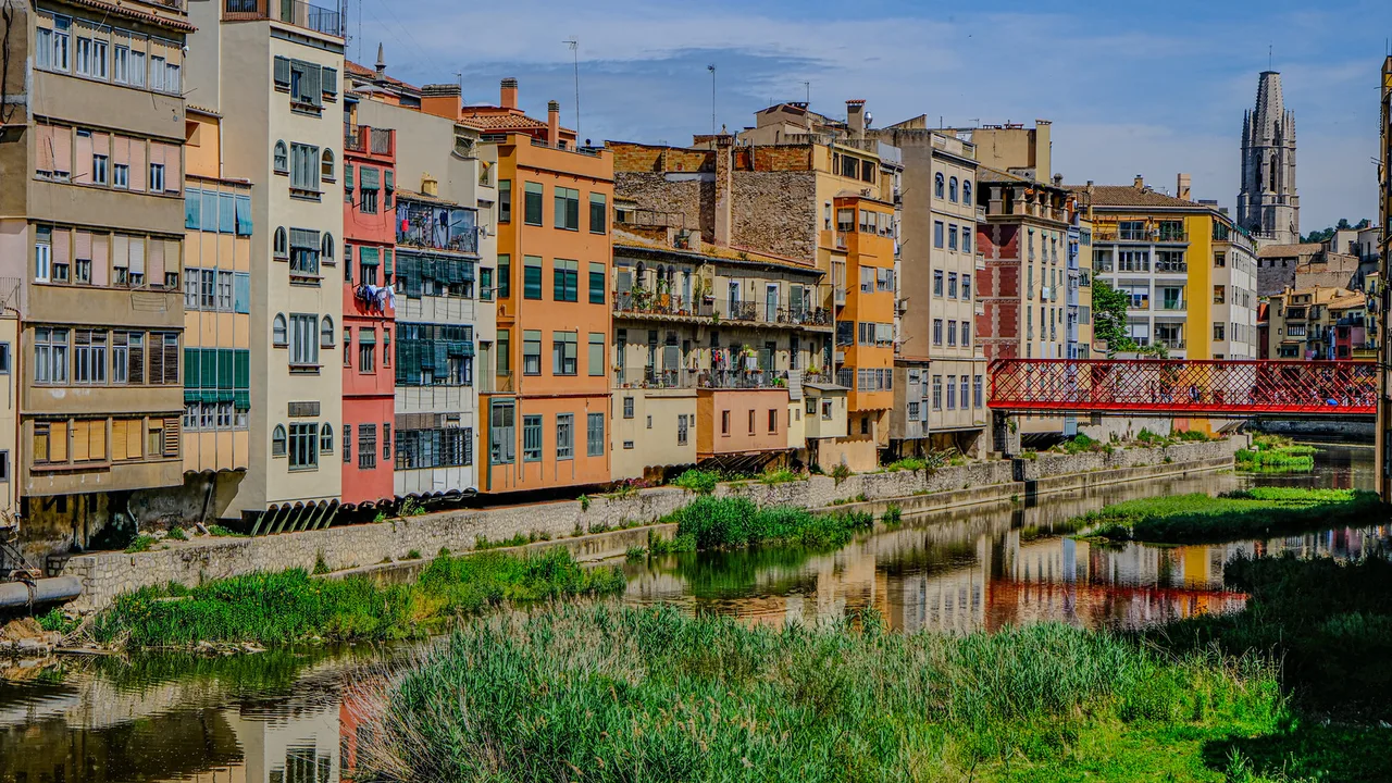 Girona's colourful riverside buildings from Pont de Pedra, Girona