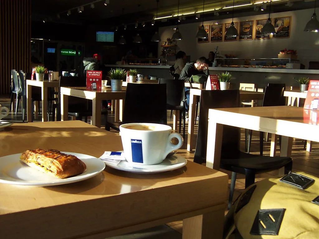Coffee, pastry and rucksack - Girona railway station buffet