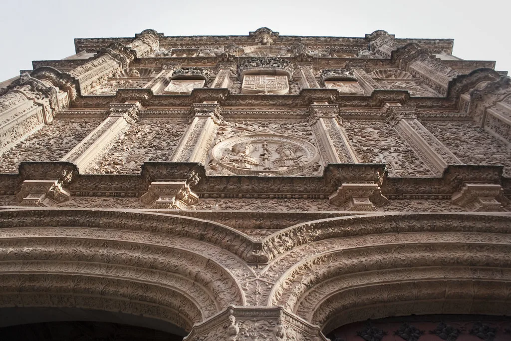 Venue view: Plateresque facade of the Universidad de Salamanca, with its famous carved frog on the decoration.